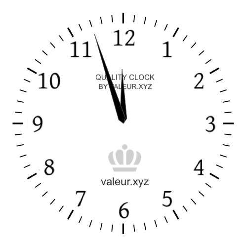 Analog clock showing the time 11:57 PM