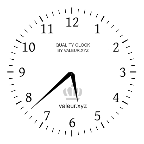 Analog clock showing the time 5:38 AM