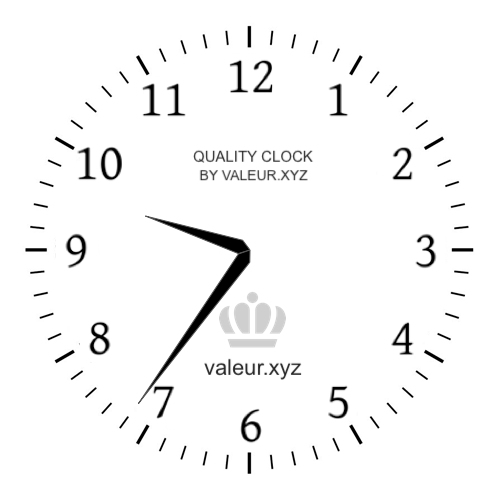 Analog clock showing the time 9:36 AM